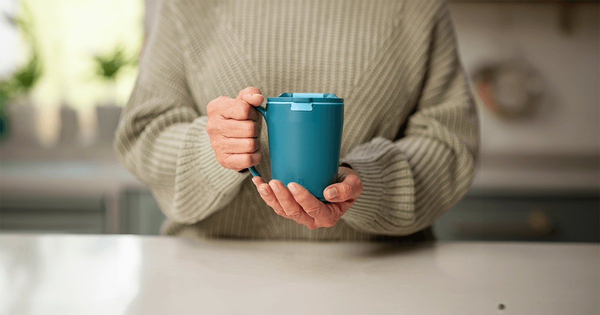Provale Pro Cup (Coming Soon) — hands holding the blue Pro mug